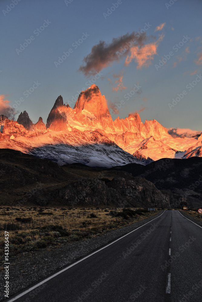 Beautiful Sunrise at a Patagonian way at a time that the sun has not yet reached the road. El Chalten, Patagonia, Argentina's trekking capital. HDR (high Dynamic Range) picture.