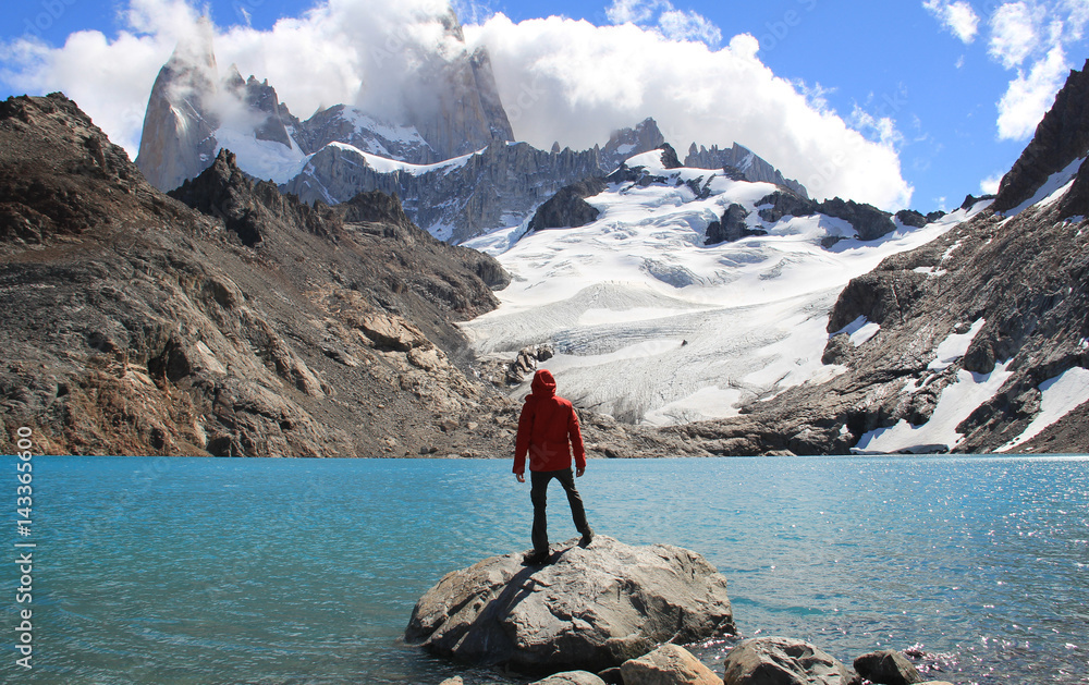 Man, blue lake, glacier and mountains. El Chalten (Argentina's Trekking Capital) - Patagonia - obrazy, fototapety, plakaty 