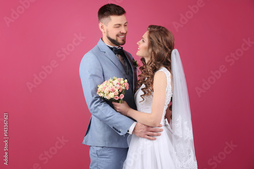 Happy wedding couple on col...