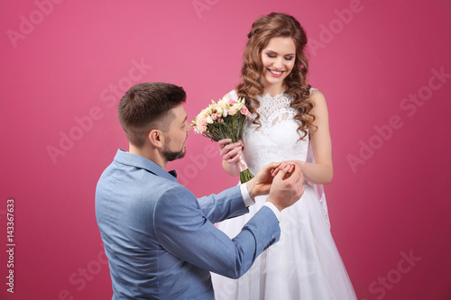 Happy wedding couple on col...