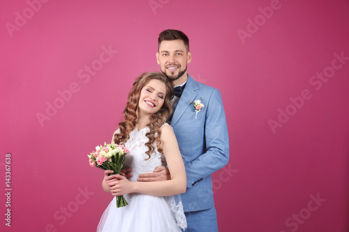 Happy wedding couple on col...