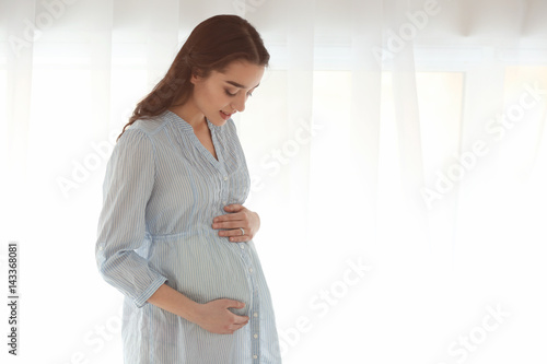 Beautiful pregnant woman st...