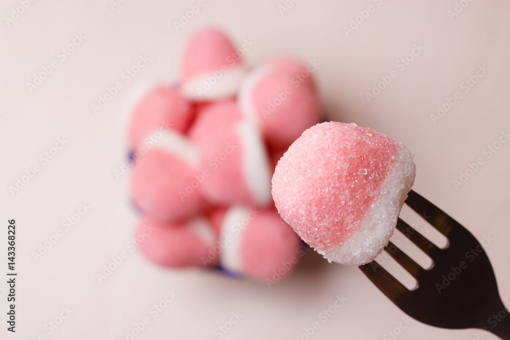 Pink gummy sweets with sugar, top view Pink gummy sweets with sugar, top view