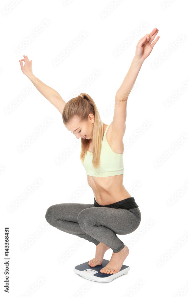 Diet concept. Young beautiful woman sitting on scales against white background Diet concept. Young beautiful woman sitting on scales against white background