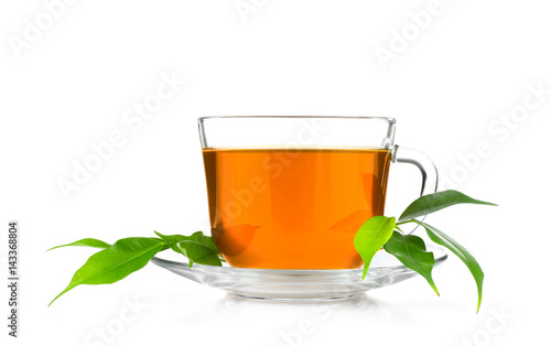 Cup of tea  and green leaves isolated on white