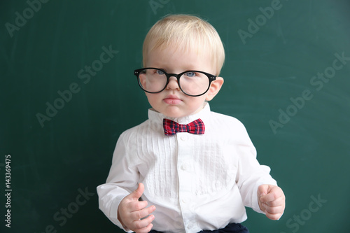 Cute little boy with glasse...