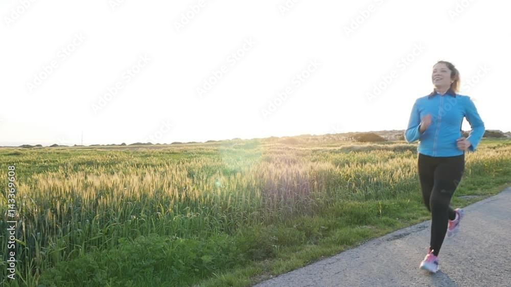 Running woman. Female Runner Jogging during Outdoor Workout Running woman. Female Runner Jogging during Outdoor Workout