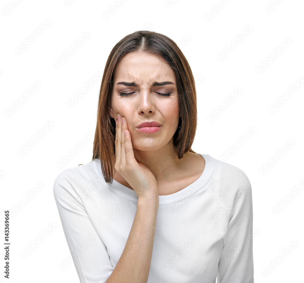Beautiful young woman suffering from toothache on white background Beautiful young woman suffering from toothache on white background