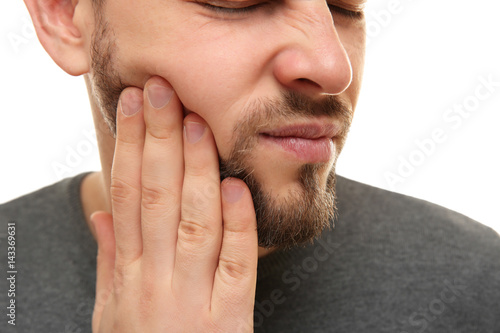 Handsome man suffering from...
