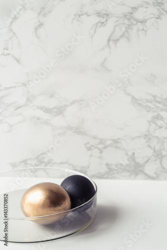 Easter decorations in the style of minimalism with golden and black eggs