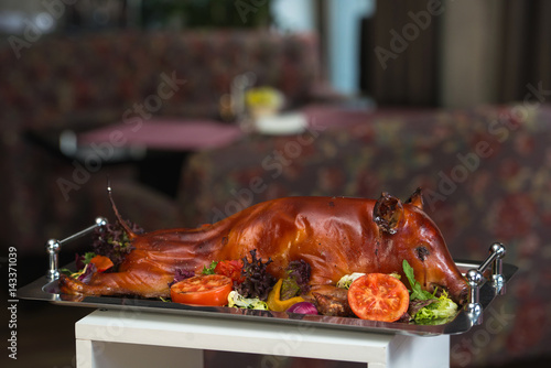 roasted suckling pig with vegetables