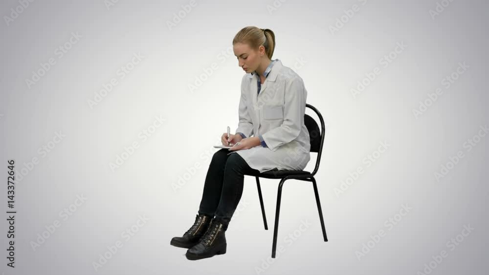 Female doctor writing recipe for a patient on white background. Female doctor writing recipe for a patient on white background.