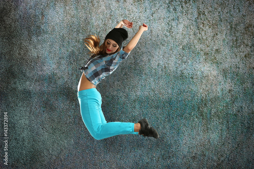 Hip hop dancer on grunge background