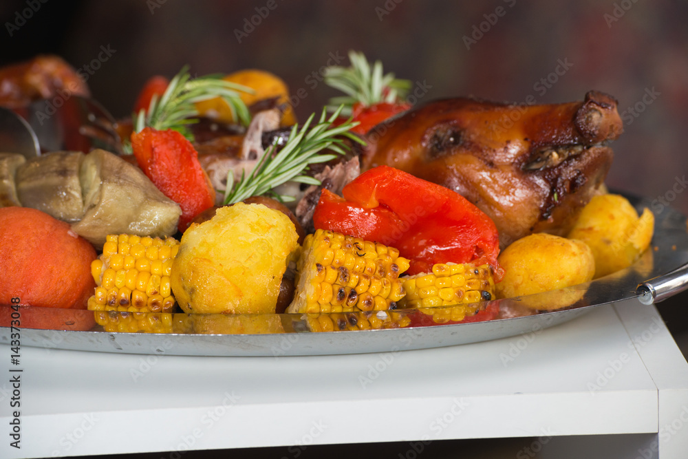 roasted suckling pig with vegetables