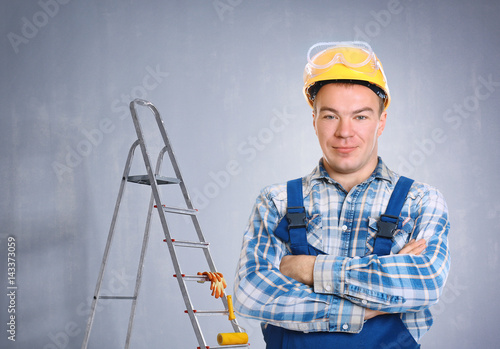 Portrait of workman in uniform on white background