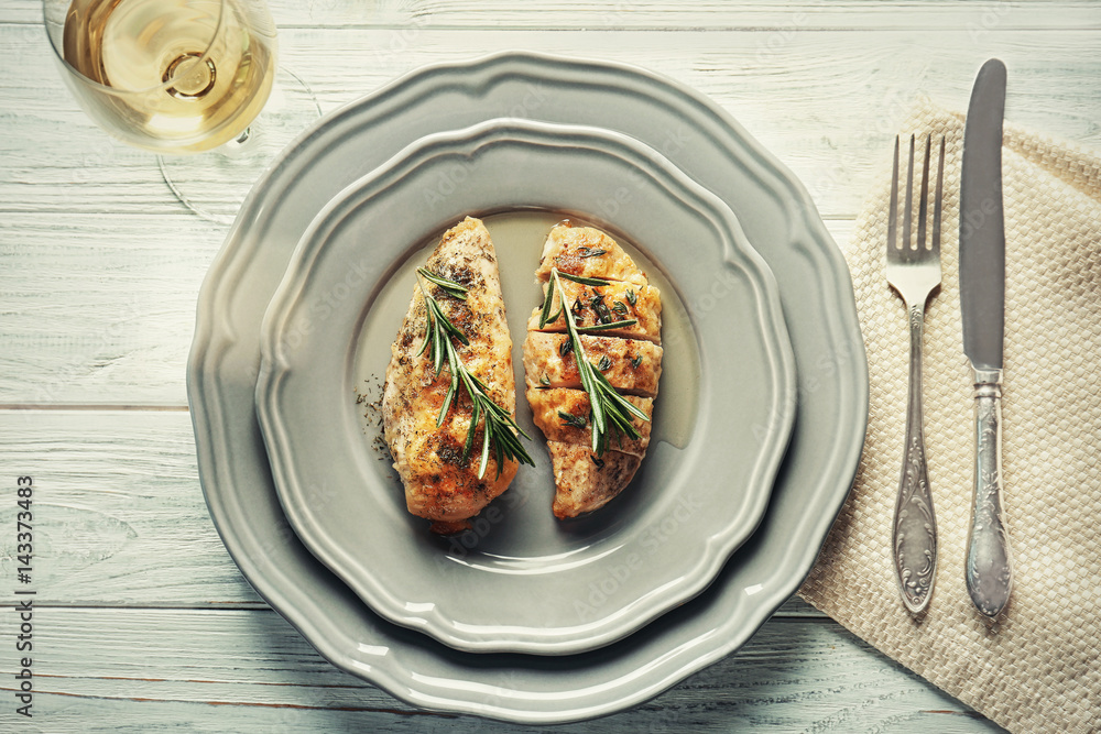 Tasty chicken breasts with rosemary on plate Tasty chicken breasts with rosemary on plate