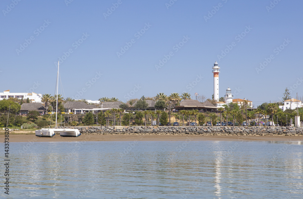 El Rompido marina and town seen from River Piedras water, Huelva, Spain El Rompido marina and town seen from River Piedras water, Huelva, Spain