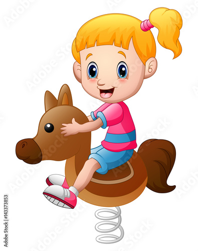 Little girl playing rocking horse 