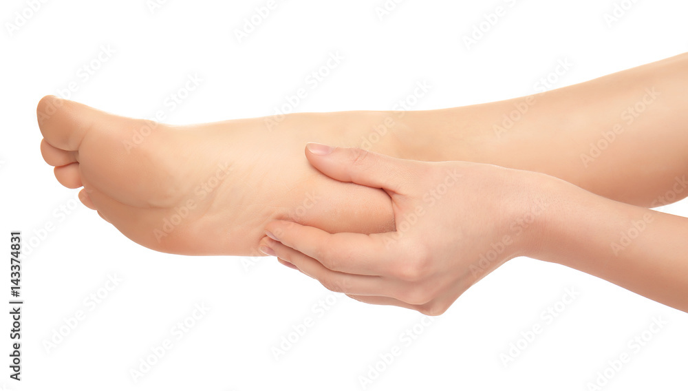 Leg of young woman suffering from pain in heel on white background