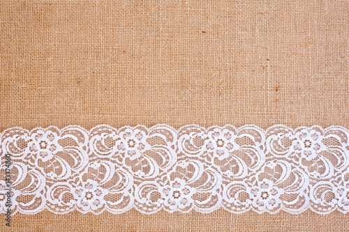 background - natural color burlap hessian with white lace border 