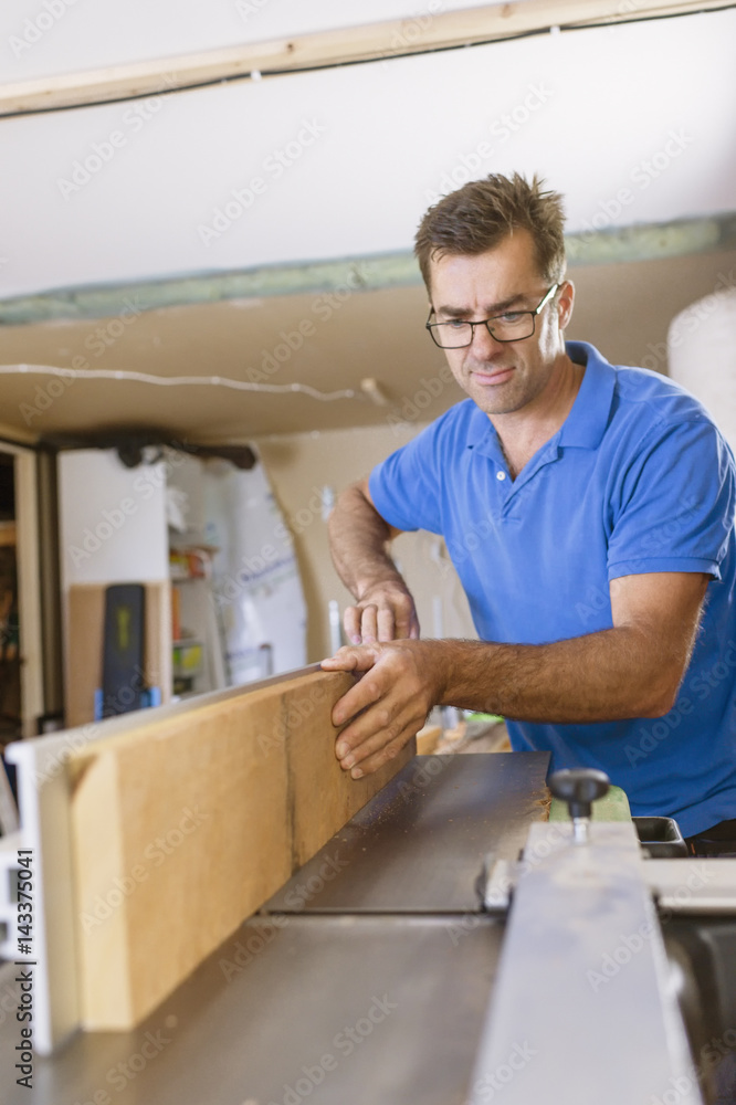 Sweden, Carpenter working with concentration Sweden, Carpenter working with concentration