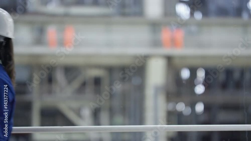 Wallpaper Mural  Long shot of team of engineers standing on platform at a power plant. Torontodigital.ca