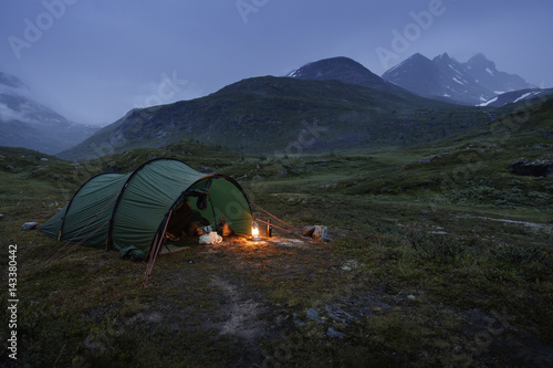 Norway, Tent by Jotunheimen range at dusk