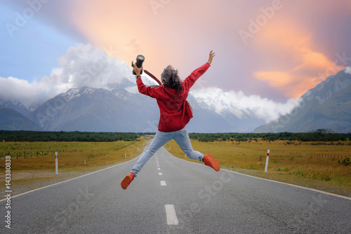 girl jumping on the road highway