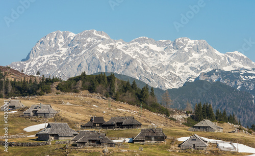 Scenic high alpine pasture Velika Planina and old traditional wooden shepherd cottages