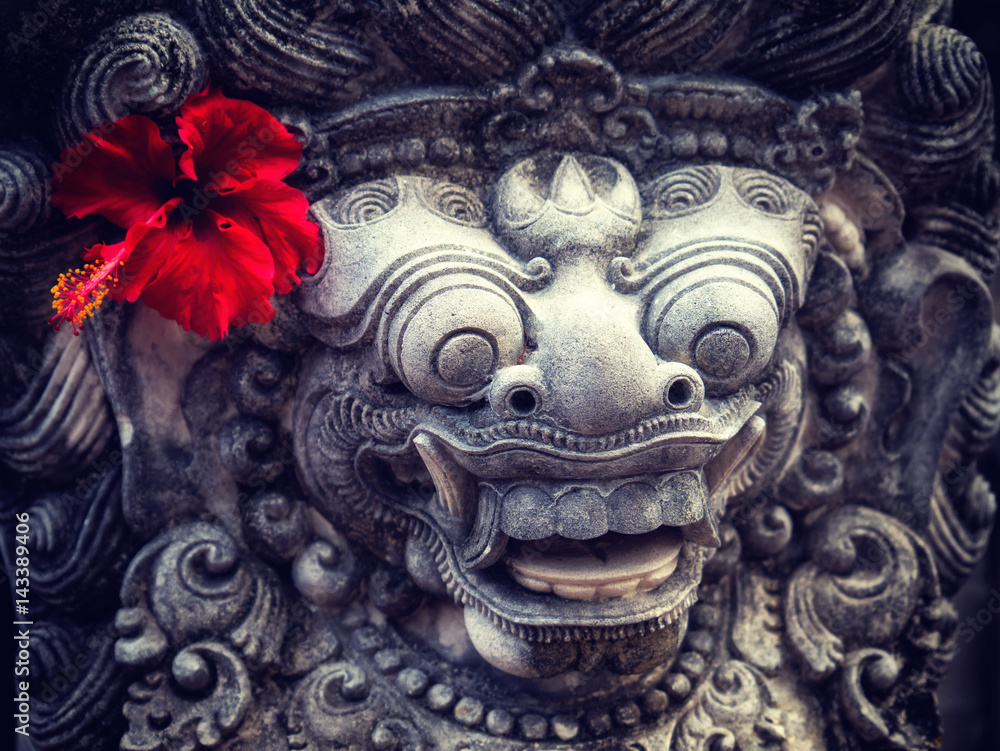 Ancient Balinese statue at the temple in Bali