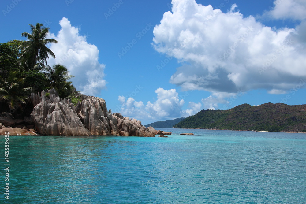 St. Pierre Island close Praslin Island, Seychelles / Beautiful scenery with blue Indian Ocean and red granite rocks.