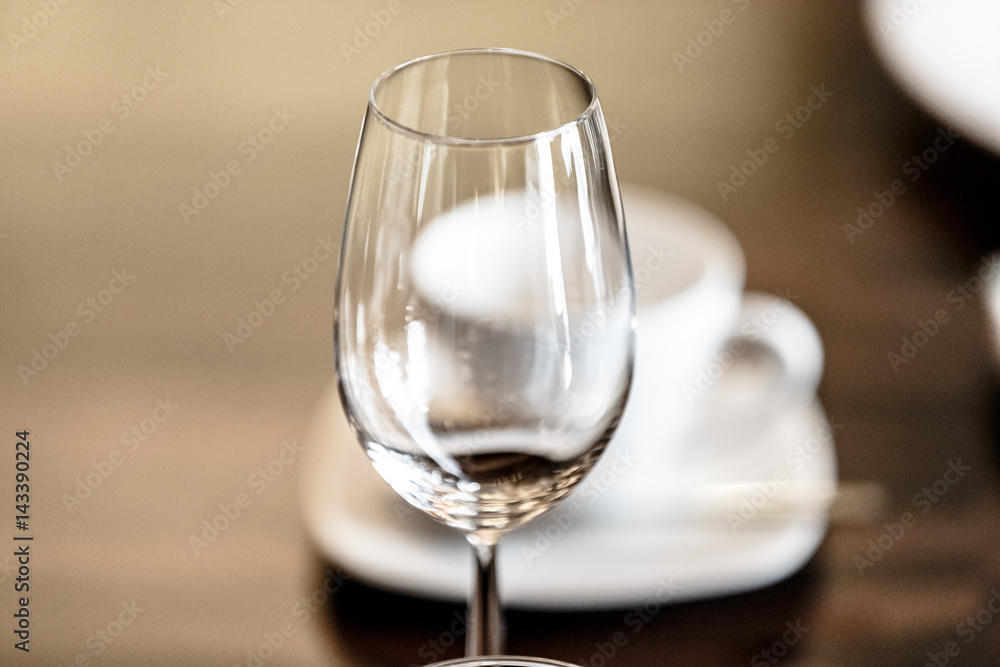 Empty wine glass standing on the table . Empty wine glass standing on the table .