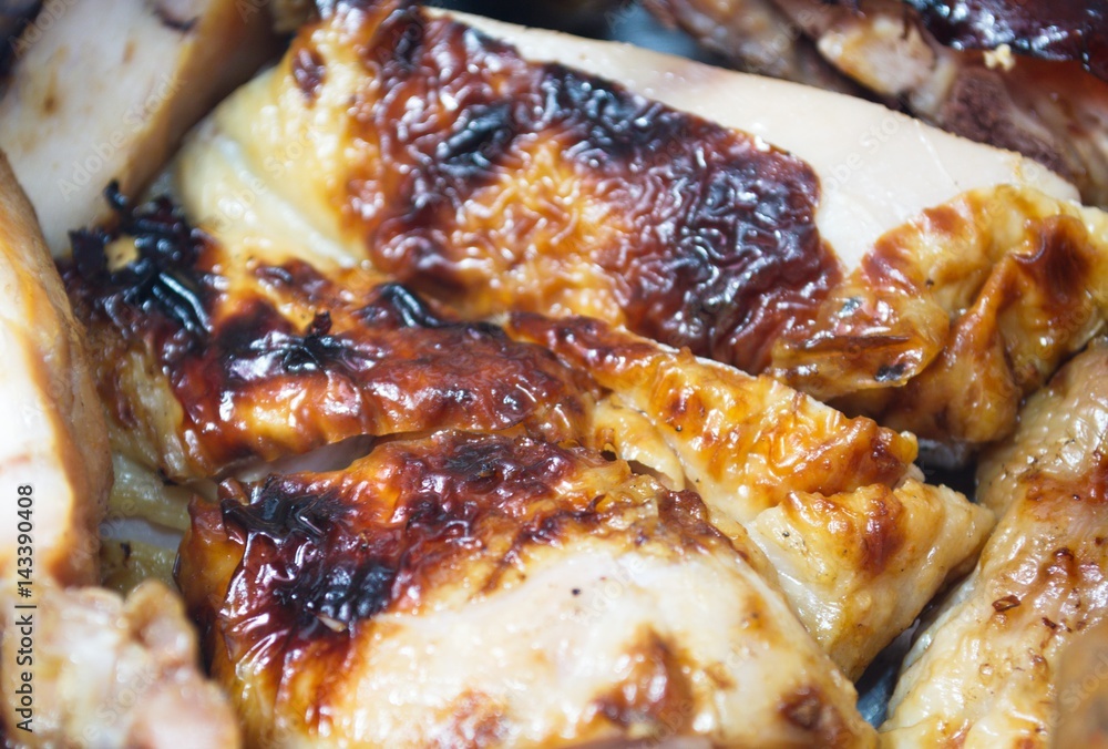 Grilled chicken cut into pieces, ready to eat.