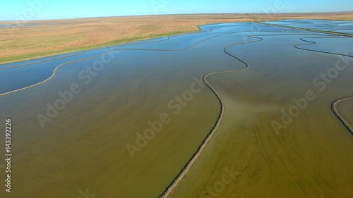 Aerial footage of Rice Crops, Ponds, Paddocks and Paddy in Hay, NSW (New South Wales) Australia. Irrigated from the Murrumbidgee River as part of the Murray Darling Basin. 
 photo