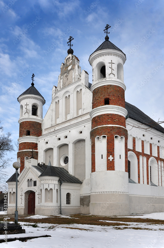 Defensive Orthodox Church of the Nativity of the Virgin in the village Murovanka, Grodno region, Belarus. Front facade, vertical view.