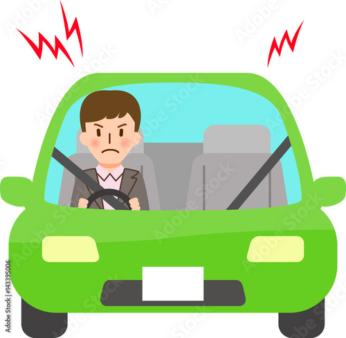 車の中でイライラしている若い男性
