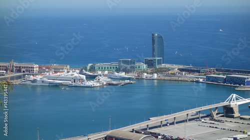 Barcelona-Spain. 28th March 2017 - View from Montjuic Castle over Port Vell and cruise-liner Azamara and W Barcelona, also known as the Hotel Vela (Sail Hotel). Lot of expensive luxury cruise ships