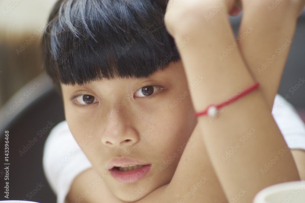 close up shot of handsome Asian boy relaxing