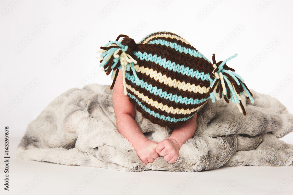 Boy Laying in Big Knitted Blanked Boy Laying in Big Knitted Blanked
