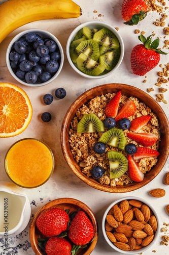 Healthy breakfast - bowl of muesli, berries and fruit