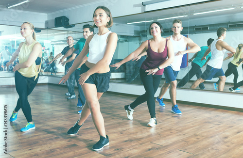 Men and ladies dancing zumba