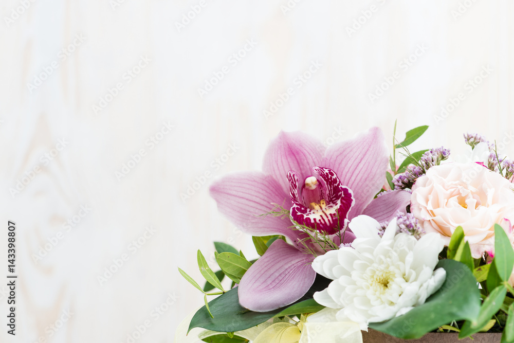 bouquet of flowers on a white wooden background. Copy space