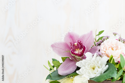 bouquet of flowers on a white wooden background. Copy space