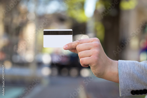 young man hand show credit card outdoor