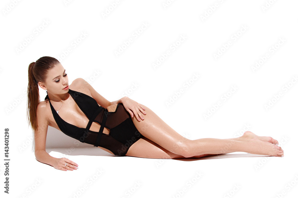 sexy blonde girl in black swimsuit with high-tail isolated on white background