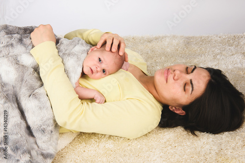 Relaxed Mother with Newborn