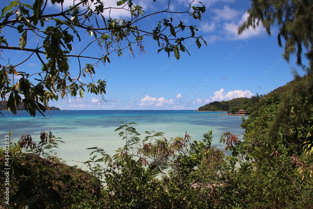 Anse Takamaka, Praslin Island, Seychelles, Indian Ocean, Africa / View to Curieuse Island.