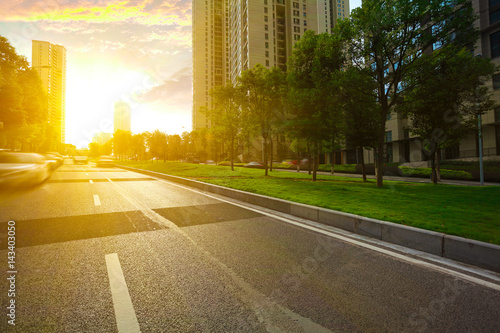 Empty road surface floor with City streetscape buildings