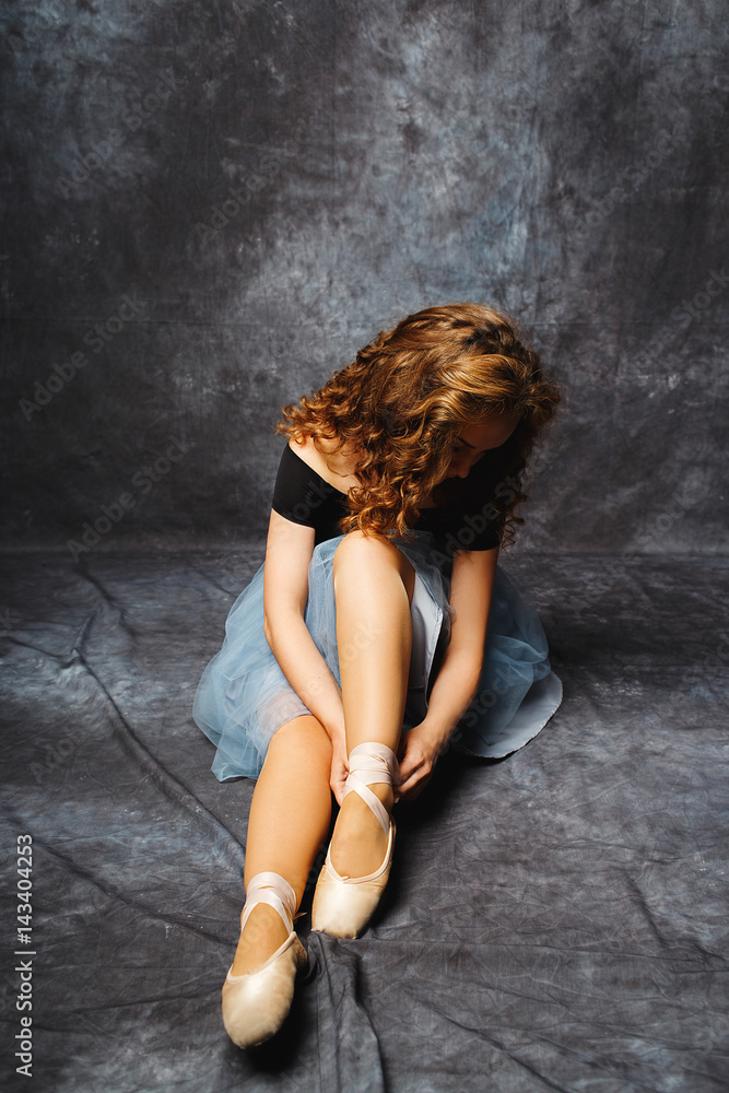 Naklejka premium Ballet dancer in blue skirt and Ballet Shoes