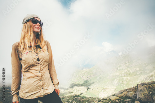 Bilde på lerret Traveler Woman hiking in foggy mountains Travel Lifestyle concept adventure summ